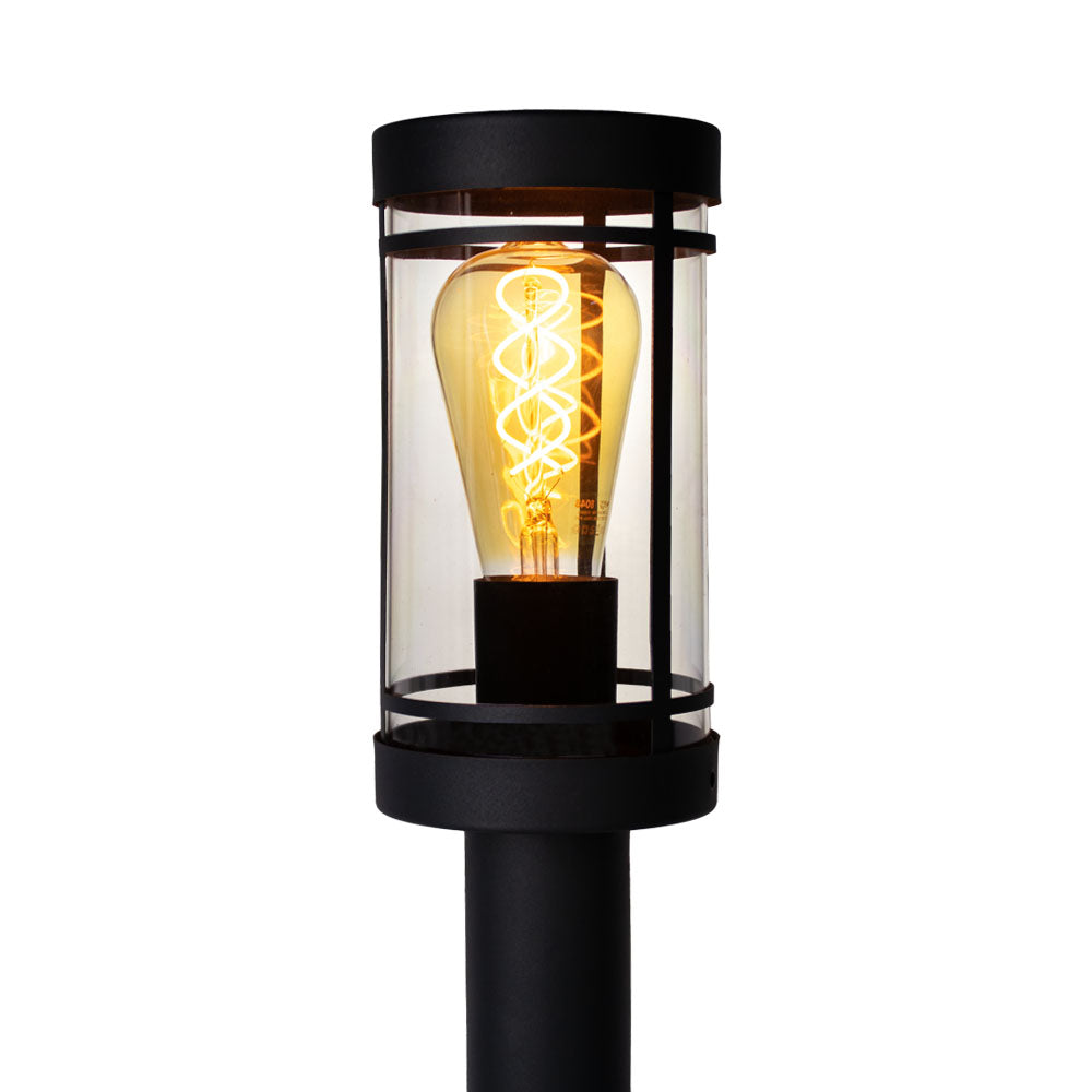 Industrielle Außenleuchte mit sichtbarer Glühfaden-LED-Lampe und zylindrischem Glasgehäuse in schwarzem Metallrahmen, Frontansicht.