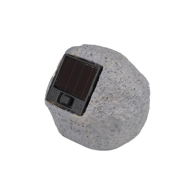 Seitenansicht einer grauen Solar-LED-Lampe in Form eines Natursteins mit eingebautem Solarpanel und Ein-/Ausschalter.