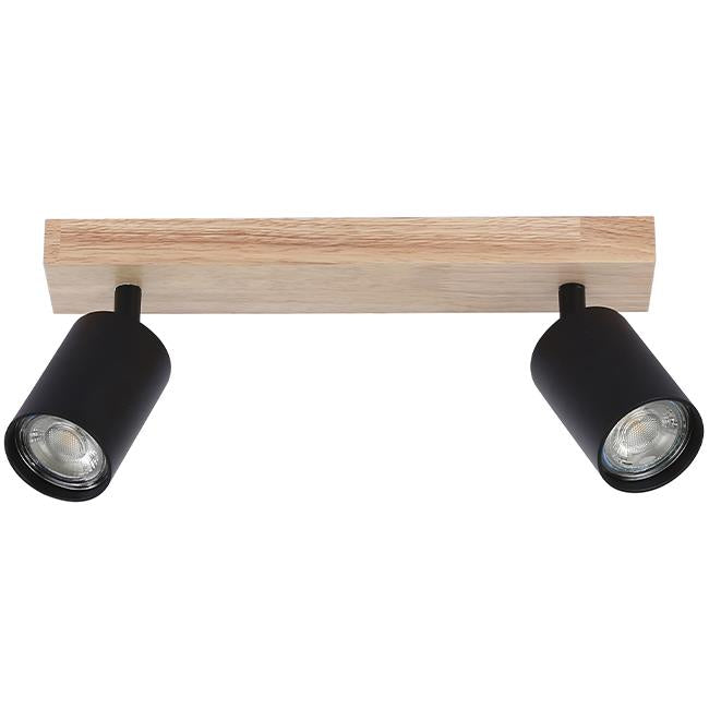 Zweiteiliger schwarzer Strahler an einem rechteckigen Deckenbalken aus Holz, Frontansicht. Moderner Deckenstrahler mit verstellbaren Zylinderlampen für fokussierte Beleuchtung.