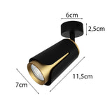 Schwarz-goldener verstellbarer Deckenstrahler mit zylindrischem Design, moderner Optik und den Maßen 11,5 cm Länge, 7 cm Breite, Deckensockel 6 cm Durchmesser und 2,5 cm Höhe – Seitenansicht mit sichtbaren Maßen.