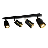 Schwarzer Deckenstrahler mit vier verstellbaren Zylinderlampen und goldenem Innenleben, moderne Schienenbeleuchtung – von unten abgewinkelt.