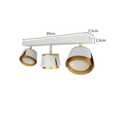 Weiß-goldener Deckenstrahler mit drei verstellbaren Strahlern, modernes Design, Maße 39 cm Breite, 7,5 cm Höhe und 2,5 cm Tiefe – von unten abgewinkelt.