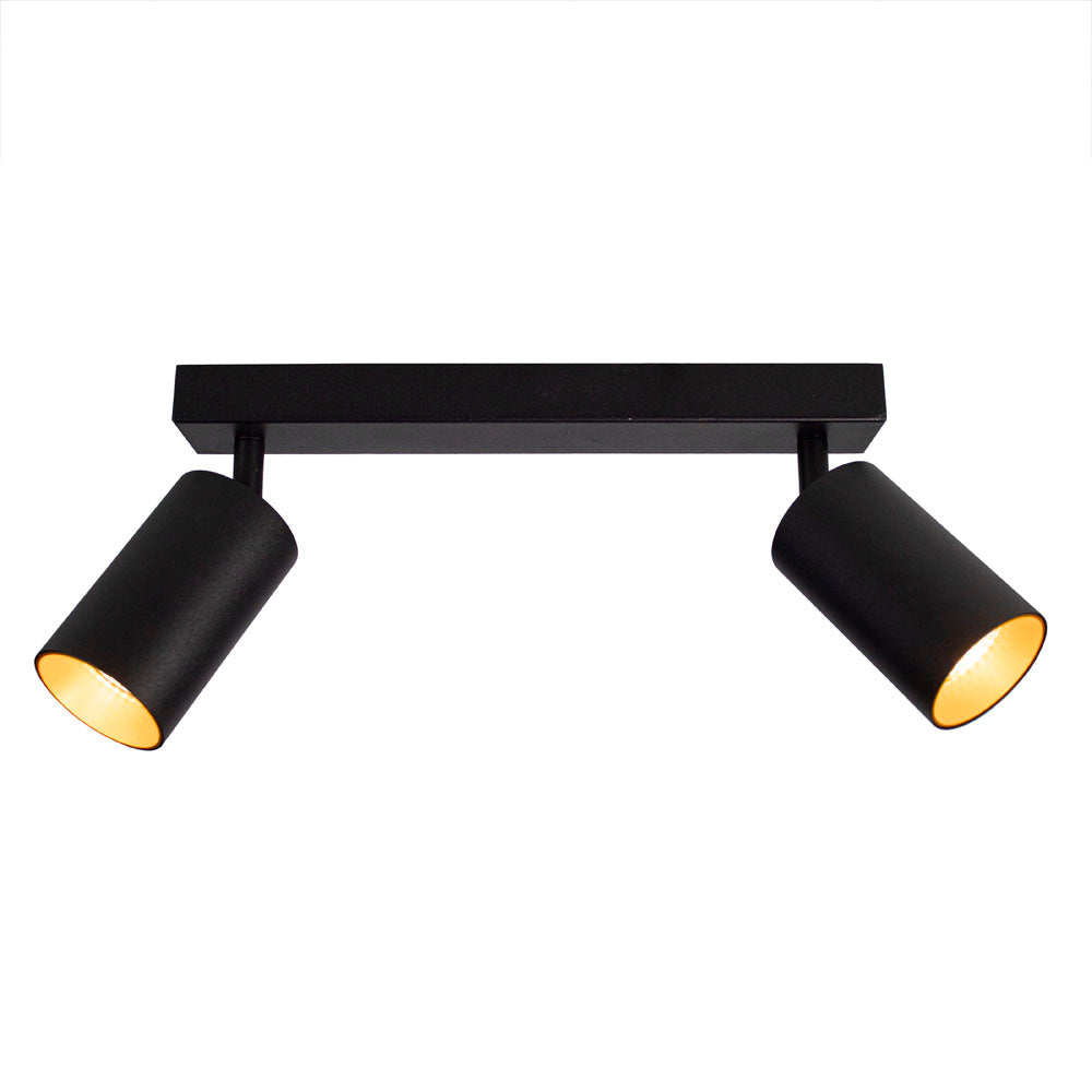Schwarzer, moderner Deckenstrahler mit zwei nach vorne gerichteten, verstellbaren zylindrischen Lampen. Ideal für fokussierte Beleuchtung in Wohn- oder Arbeitsräumen.