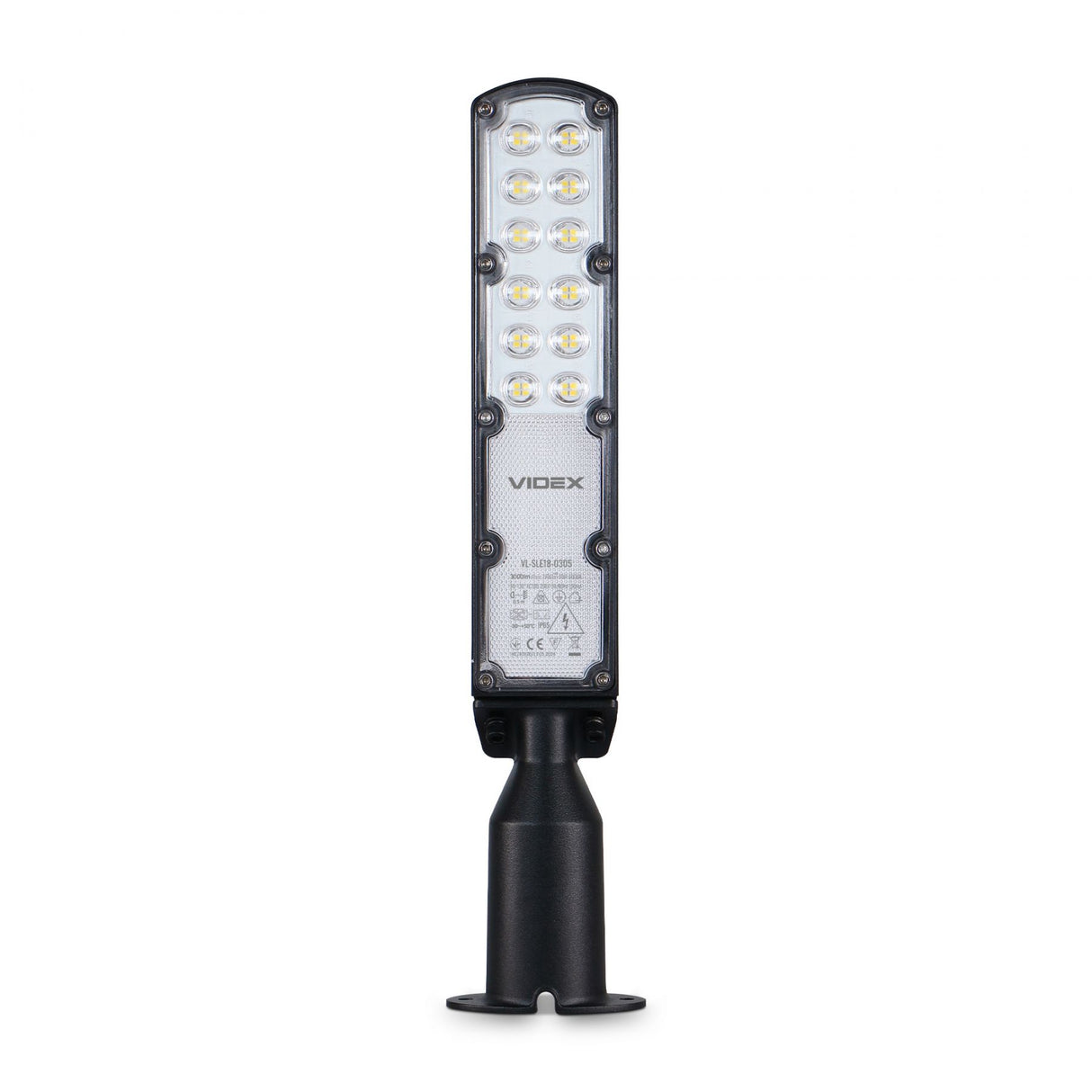 Vorderansicht der Videx LED-Außenleuchte Typ VL-SL10B-C005, mit schlankem, rechteckigem Design und mehreren LED-Lichtpunkten, montiert auf einem schwarzen Sockel zur Wand- oder Mastmontage.