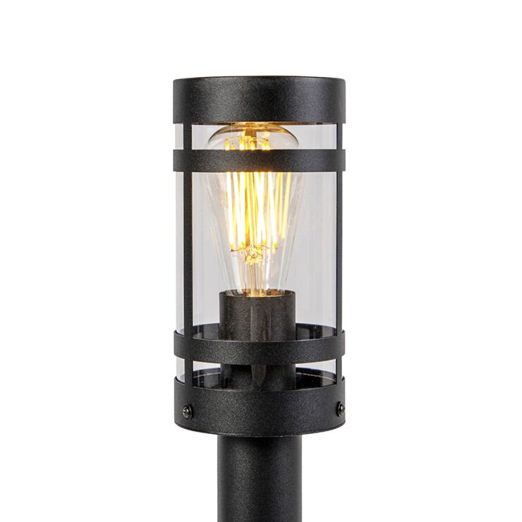 Schwarze moderne Außenleuchte mit transparentem Glasgehäuse und sichtbarem Glühfaden, Frontansicht.