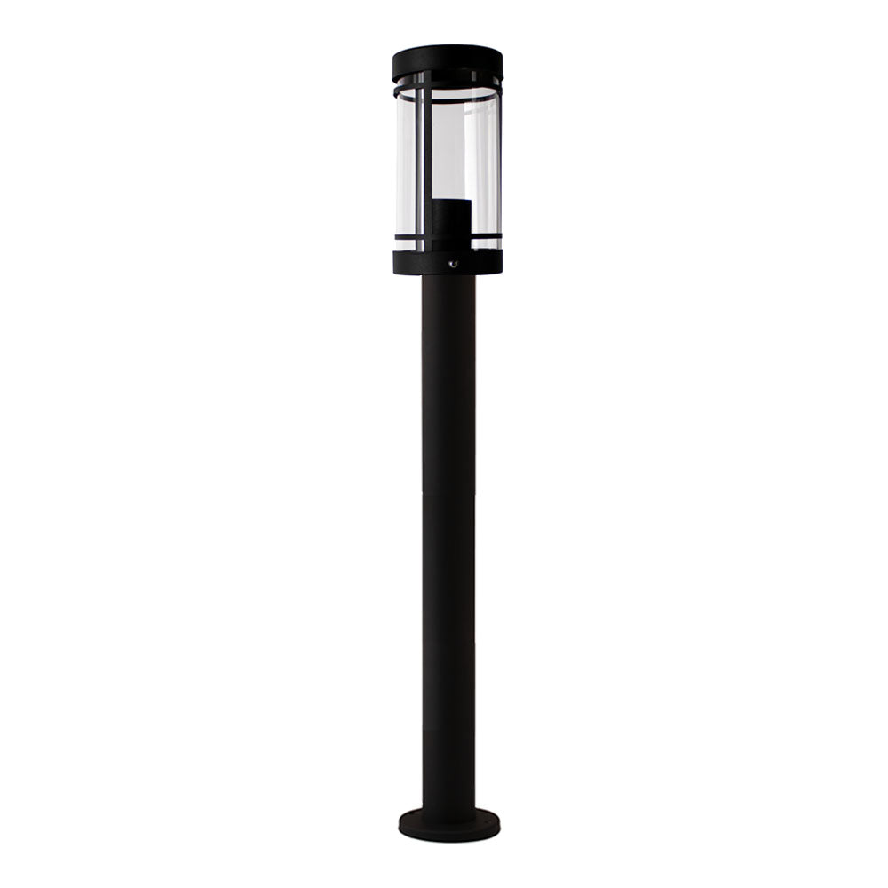Moderne schwarze Außenleuchte auf einem Mast mit zylindrischem transparentem Gehäuse, Frontalansicht.