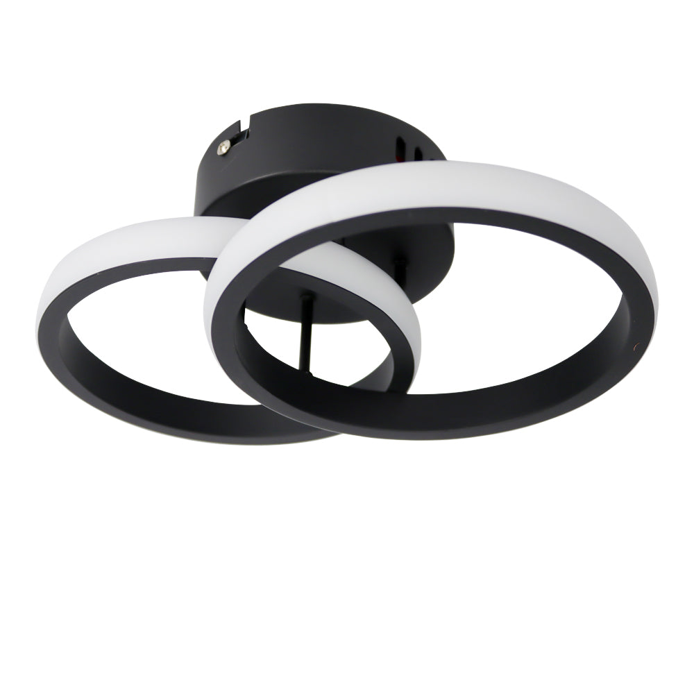 Moderne schwarze Deckenleuchte mit zwei runden LED-Ringen in überlappendem Design, schräg von unten.