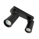Schwarzer Doppel-Deckenstrahler mit schwenkbaren Zylinderlampen, modernes Design, von unten schräg fotografiert für eine klare Sicht auf die Lichtquellen und die Verarbeitung.